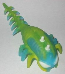 Part 11164pb02 - Hero Factory Brain with Molded Hard Plastic Glow In Dark White Eyes and Spikes and Marbled Yellow Pattern - Flexible Rubber - De BrickPlaats
