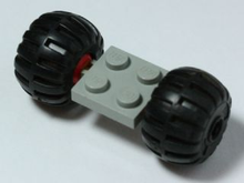 Part 122c01assy4 - Plate, Modified 2 x 2 with Red Wheels with 2 Black Wheel Full Rubber Balloon with Axle Hole (122c01 / 4288) - De BrickPlaats