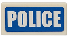 Part 3069pb0111 - Tile 1 x 2 with White 'POLICE' Thick Font on Blue Background Pattern (Sticker) - Sets 7235-2 / 7236-2 / 7744 / 60023 - De BrickPlaats