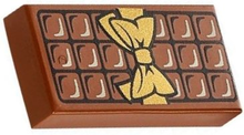 Part 3069pb0440 - Tile 1 x 2 with Candy Bar Chocolate Blocks and Gold Bow Pattern - De BrickPlaats