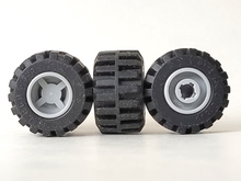 Part 6014bc05 - Wheel 11mm D. x 12mm, Hole Notched for Wheels Holder Pin with Black Tire 21mm D. x 12mm - Offset Tread Small Wide, Band Around Center of Tread (6014b / 87697) - De BrickPlaats