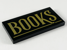 Part 87079pb0671 - Tile 2 x 4 with Gold 'BOOKS' and Underline Pattern - De BrickPlaats
